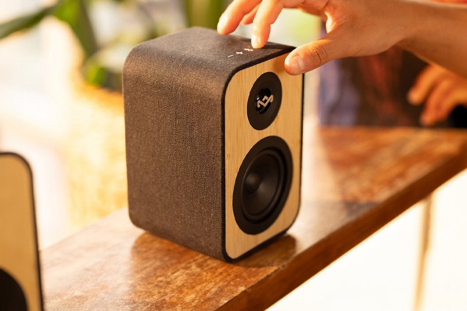 A person using the House of Marley Uplift Bluetooth Speaker.